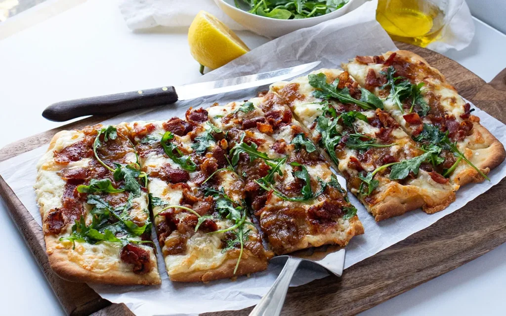 Flatbread with Caramelized Onions, Bacon and Arugula